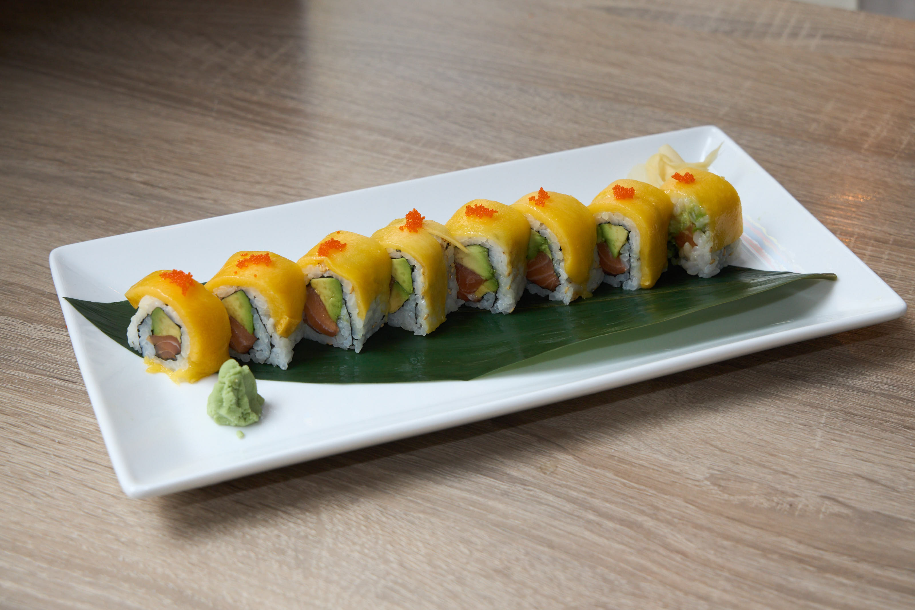 Mango roll with tobiko and avocado side view