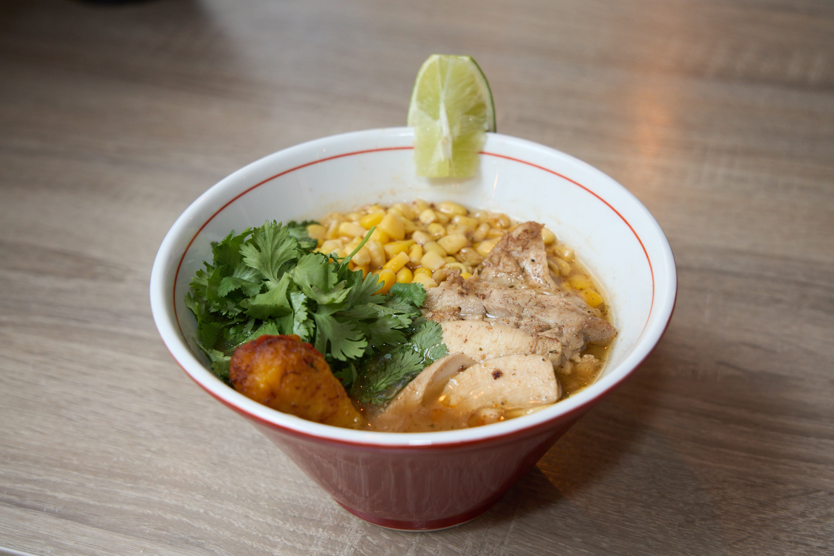 Ramen bowl with chicken, corn, and cilantro